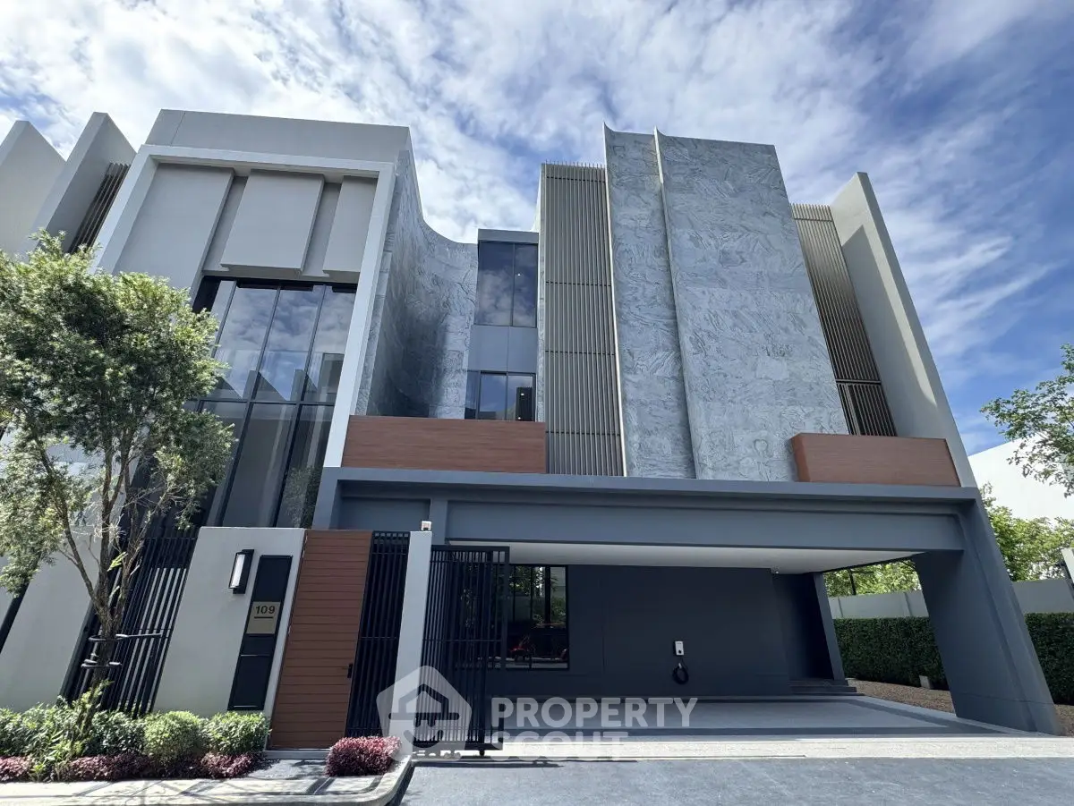 Modern architectural building with sleek facade and lush greenery