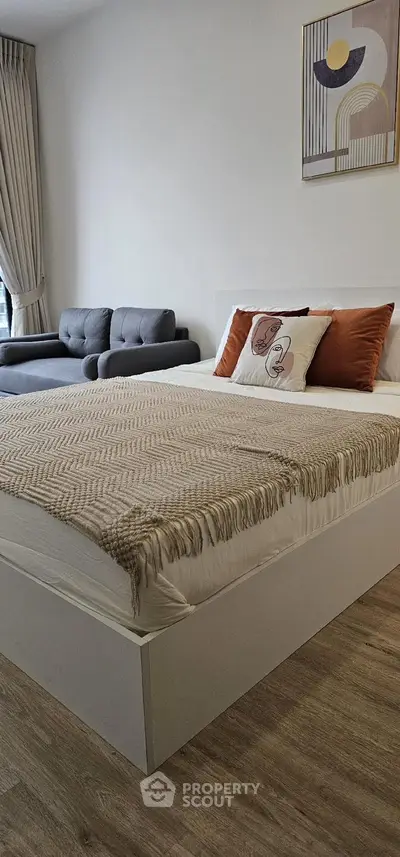 Modern bedroom with stylish decor and cozy seating area