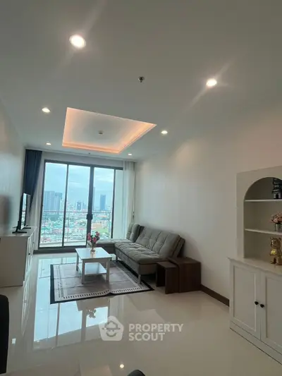 Modern living room with city view, sleek furniture, and large windows.