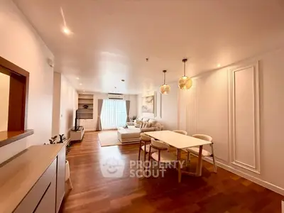 Spacious modern living room with elegant dining area and stylish decor