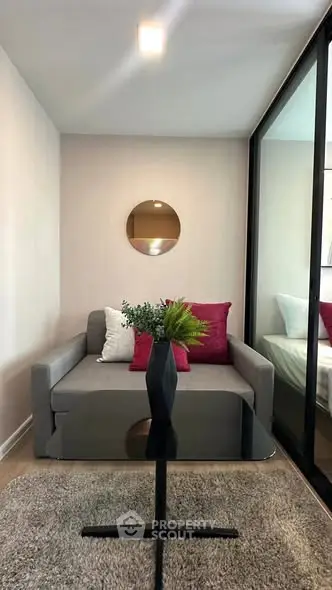 Modern living room with stylish decor and cozy seating area, perfect for relaxation.