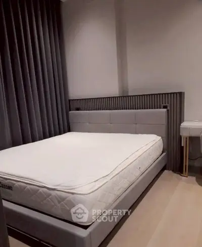 Modern bedroom with stylish bed and elegant decor, perfect for a cozy and comfortable living space.