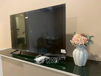 Modern living room with sleek TV and elegant floral decor