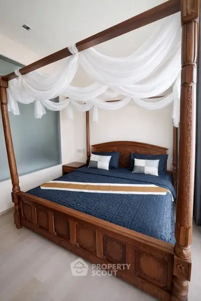 Luxurious bedroom with elegant four-poster bed and stylish decor