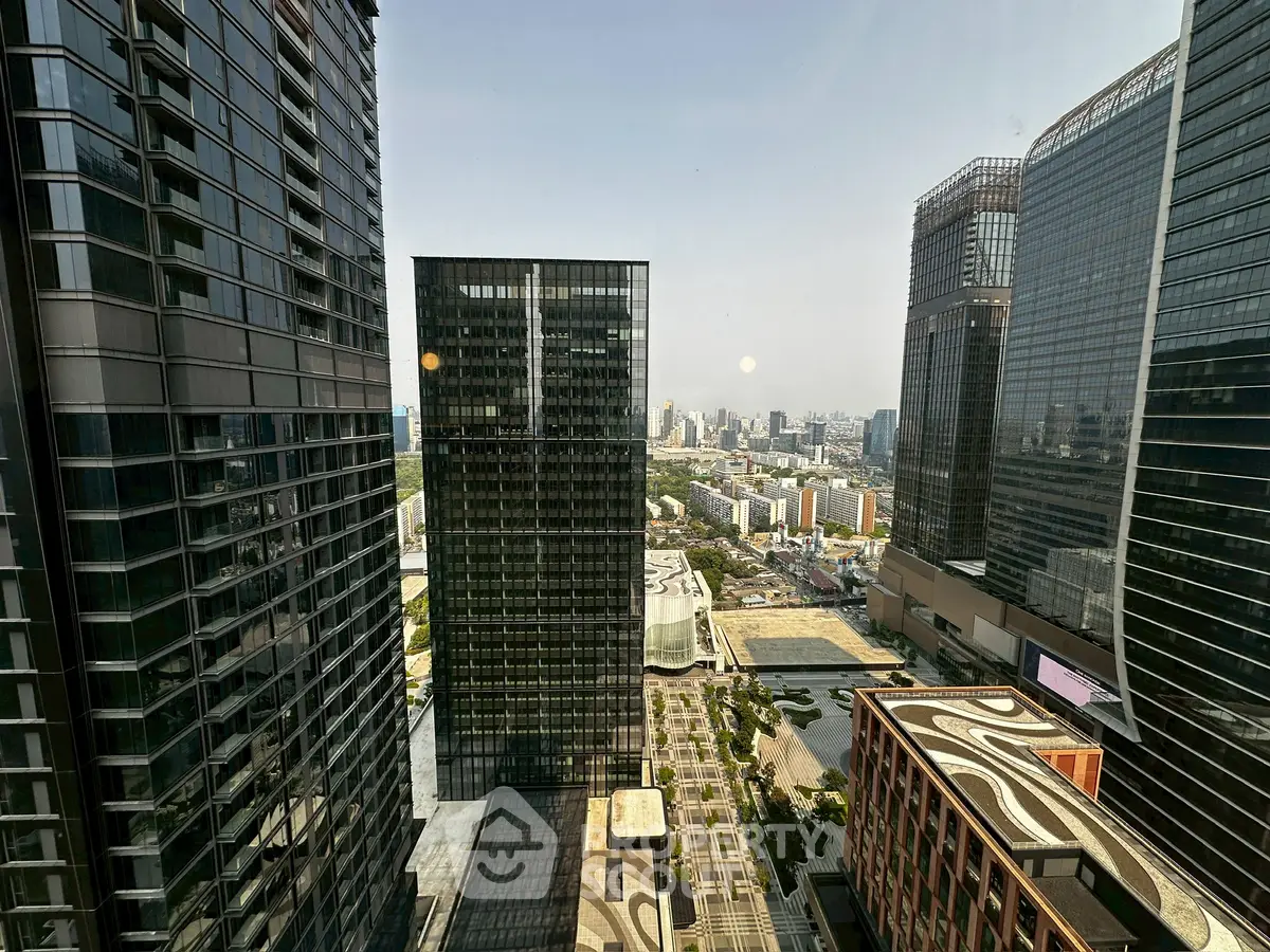 Stunning cityscape view from high-rise building with modern architecture and expansive skyline.