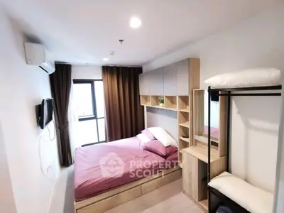 Modern bedroom with stylish furniture and natural light, perfect for urban living.