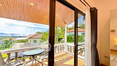 Stunning balcony view with outdoor seating and scenic landscape