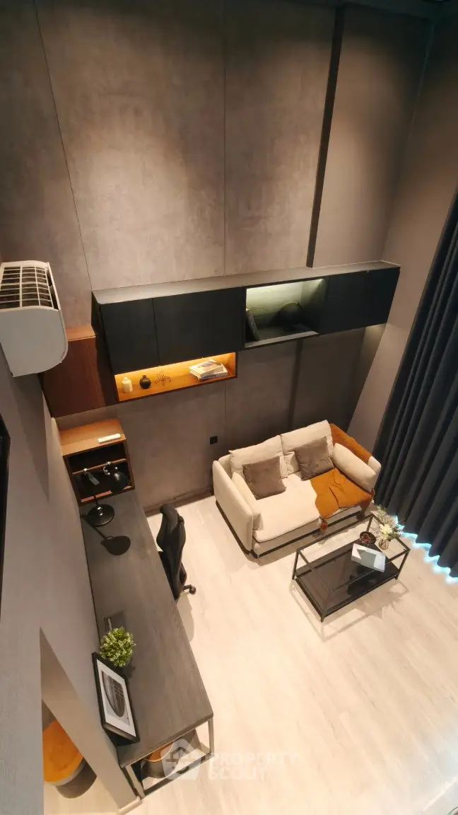 Modern loft-style living room with high ceilings and sleek furniture
