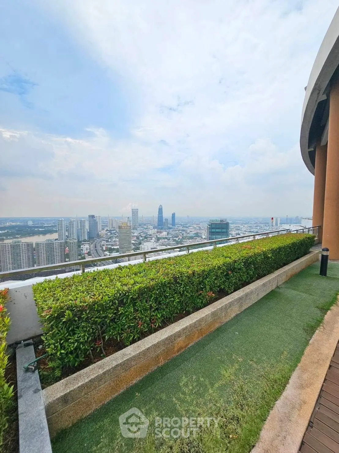 Stunning rooftop garden with panoramic city view, perfect for relaxation and urban living.