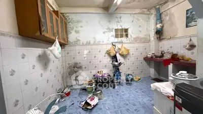 Rustic kitchen with vintage charm and unique tiled walls