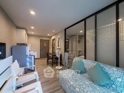 Modern living room with stylish decor and open layout in a contemporary apartment.