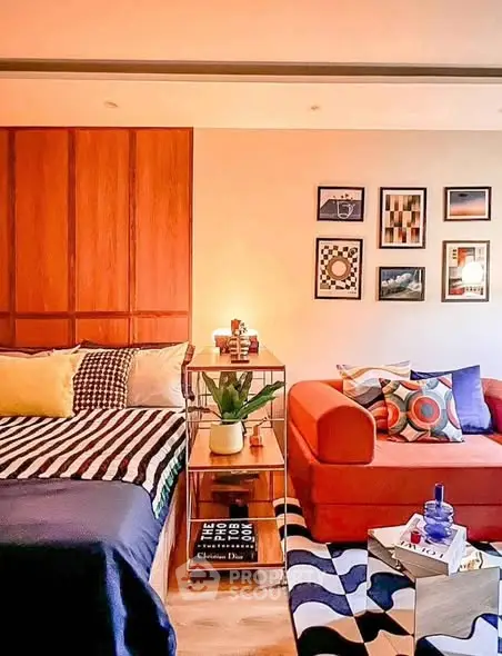 Stylish modern bedroom with vibrant decor and cozy seating area, perfect for urban living.