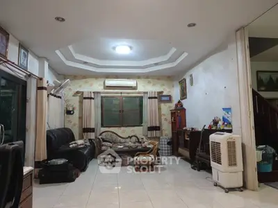 Spacious living room with classic decor and cozy seating area.