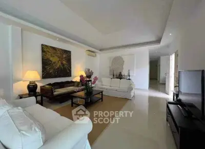 Spacious modern living room with elegant decor and ample natural light
