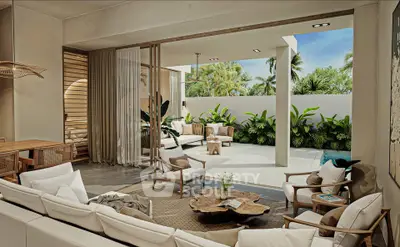 Luxurious open-plan living room with seamless indoor-outdoor flow to tropical garden patio.