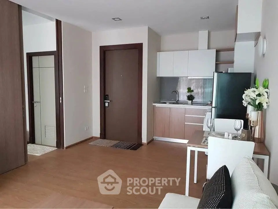 Modern apartment interior with open kitchen and cozy living area