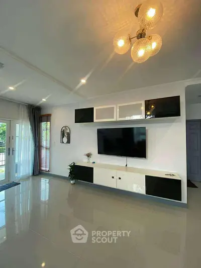 Spacious modern living room with sleek TV unit and elegant lighting