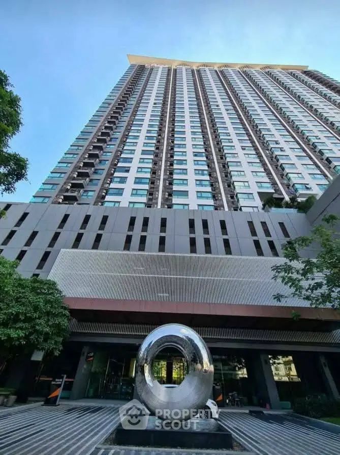 Stunning high-rise building with modern architecture and sleek design in urban setting.
