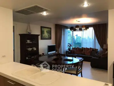 Spacious living room with elegant decor and city view, perfect for modern urban living.