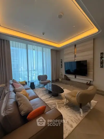 Luxurious living room with modern decor and large windows offering stunning views.