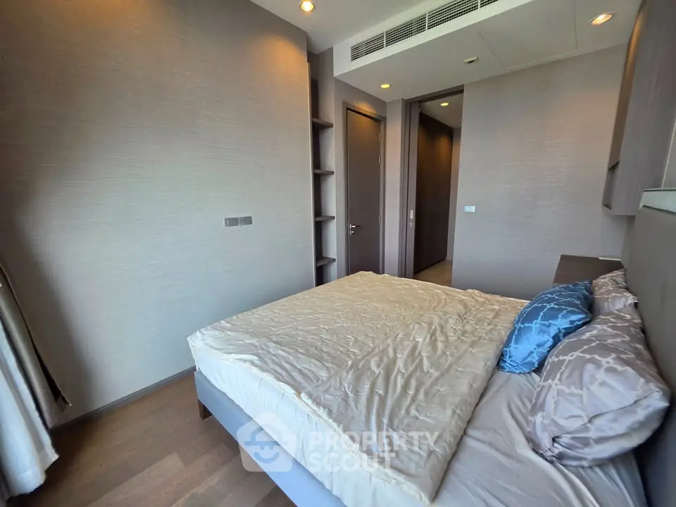 Modern bedroom with stylish decor and natural light