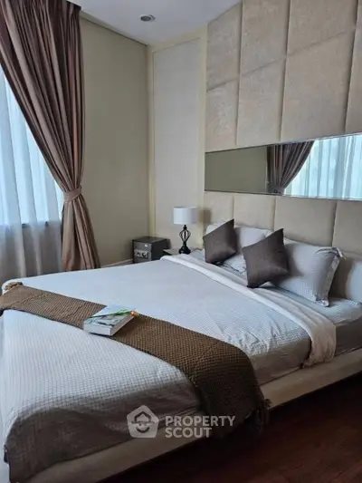 Luxurious bedroom with elegant decor and plush bedding in modern apartment