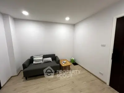 Minimalist living room with modern sofa and wooden floor