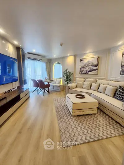 Luxurious living room with modern decor, spacious seating, and elegant lighting, perfect for relaxation and entertainment.