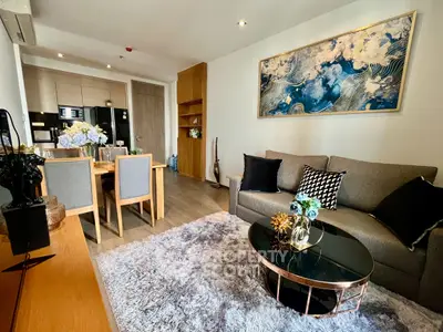 Modern living room with stylish decor and open kitchen layout