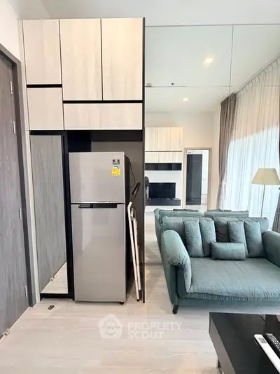 Modern living room with sleek furniture and built-in storage cabinets