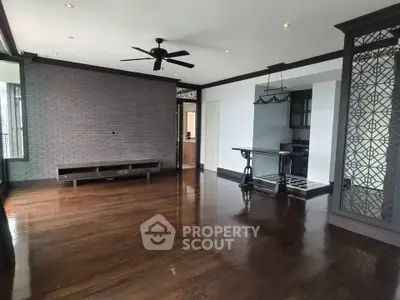 Spacious living room with hardwood floors and modern design elements