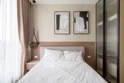 Modern bedroom with stylish decor and natural light