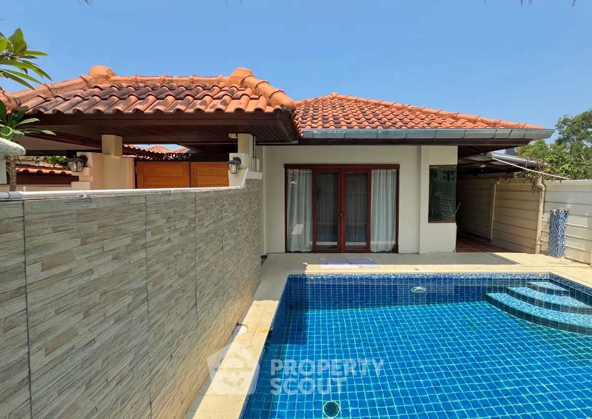 Charming villa with private pool and tiled roof, perfect for luxurious living.
