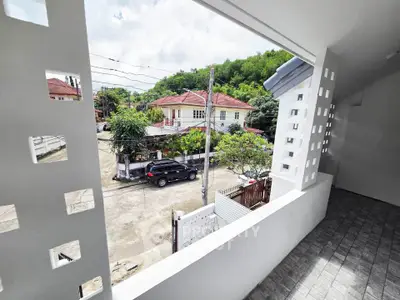 Spacious balcony with scenic neighborhood view, perfect for relaxation and outdoor enjoyment.