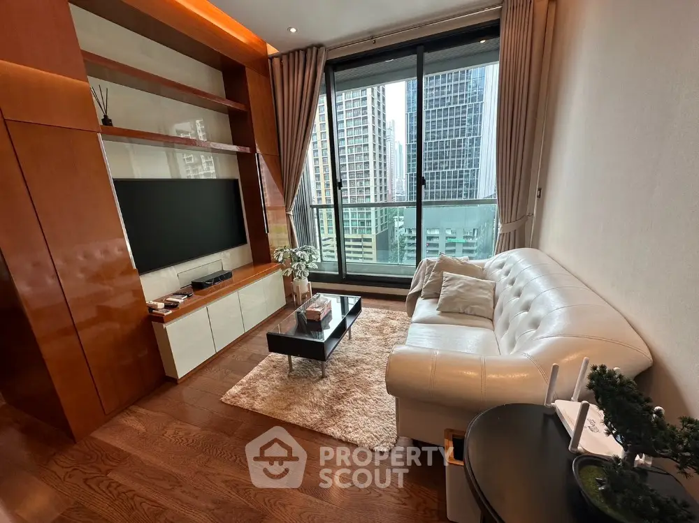 Luxurious living room with city view, modern furniture, and elegant decor in high-rise apartment.