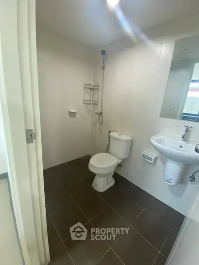 Modern bathroom with sleek fixtures and neutral tiles, perfect for a minimalist design.