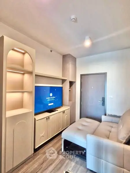 Modern living room with sleek furniture and built-in TV unit