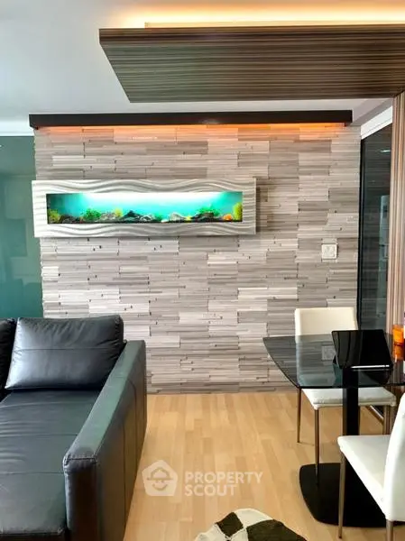 Modern living room with stylish wall aquarium and sleek furniture