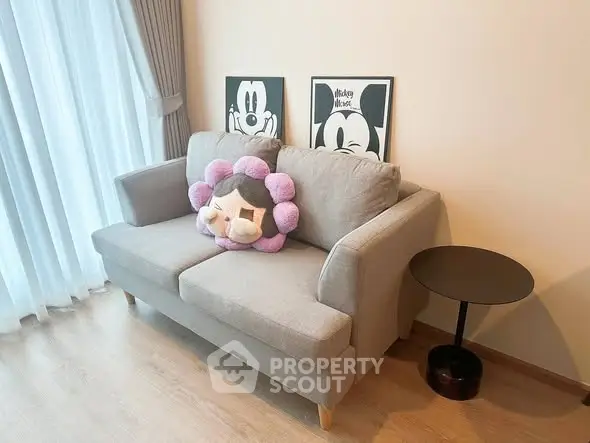 Cozy living room with stylish sofa and playful decor, perfect for relaxation and entertainment.