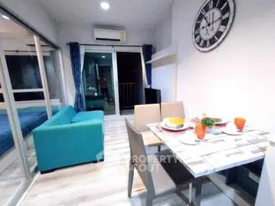 Modern living room with dining area and balcony access