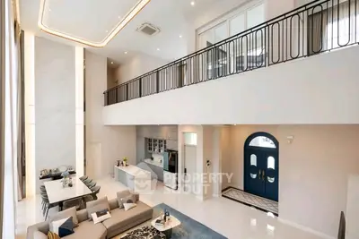 Luxurious modern living room with high ceilings and elegant interior design