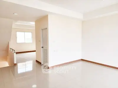 Spacious and bright interior with glossy tiled floors and neutral walls, ideal for customization.