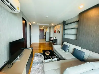 Modern living room with stylish decor and comfortable seating in a contemporary apartment.