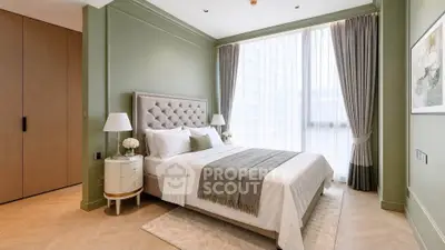 Luxurious bedroom with elegant decor and large window in modern apartment
