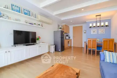 Spacious living room with modern decor and open kitchen layout