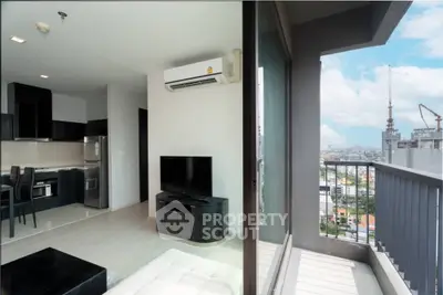 Modern apartment with open layout and balcony view of city skyline
