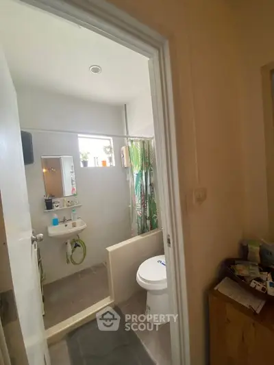 Cozy bathroom with modern fixtures and natural light, perfect for a refreshing start to your day.