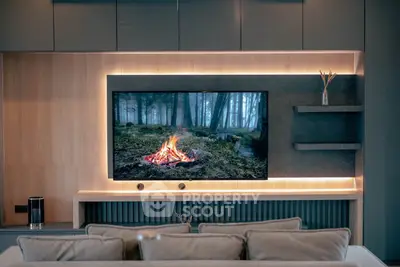 Modern living room with sleek TV setup and ambient lighting