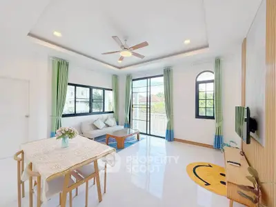 Bright and airy living room with modern decor and large windows.