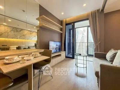 Modern living room with city view, stylish decor, and cozy seating area.